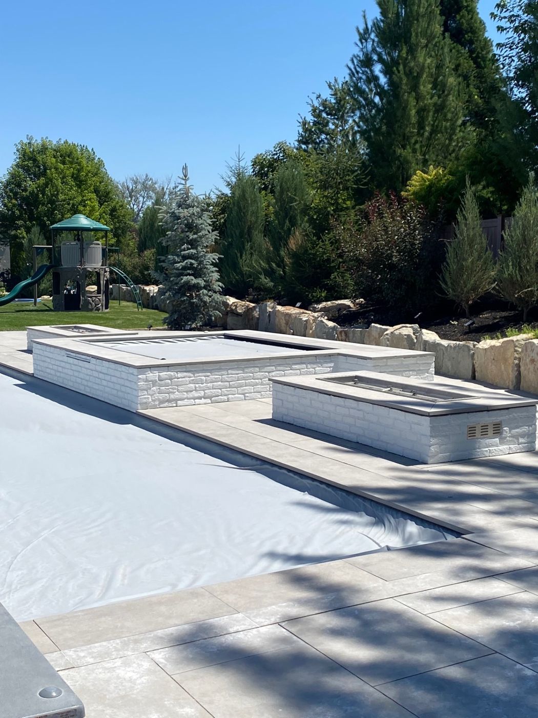 Backyard spa with white brick surrounds